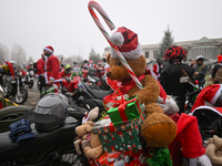 KRAKOW, POLAND - DECEMBER 08: Hundreds of motorcycles parked outside the Pediatric Hospital in Krakow as Santa Clauses deliver Christmas gif...