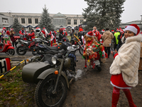 KRAKOW, POLAND - DECEMBER 08: Hundreds of motorcycle riders dressed as Santa Claus form a human chain to deliver Christmas gifts to young pa...