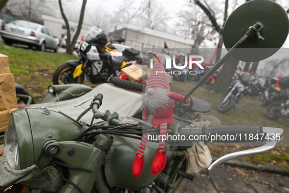 KRAKOW, POLAND - DECEMBER 08: Christmas decorations seen of motorcycles parked outside the Pediatric Hospital in Krakow as Santa Clauses del...