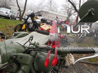 KRAKOW, POLAND - DECEMBER 08: Christmas decorations seen of motorcycles parked outside the Pediatric Hospital in Krakow as Santa Clauses del...