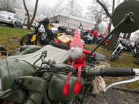 KRAKOW, POLAND - DECEMBER 08: Christmas decorations seen of motorcycles parked outside the Pediatric Hospital in Krakow as Santa Clauses del...