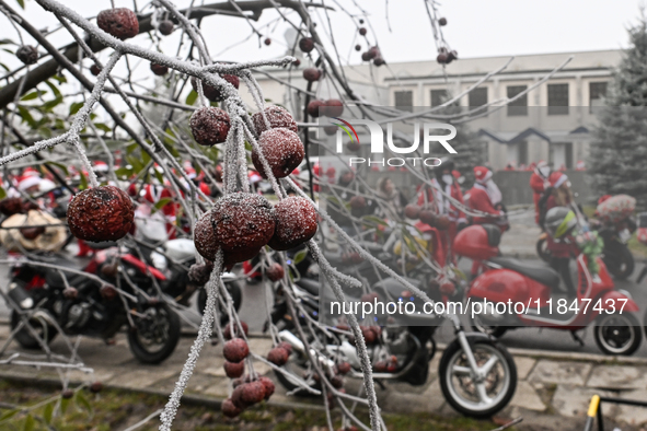 KRAKOW, POLAND - DECEMBER 08: Hundreds of motorcycles parked outside the Pediatric Hospital in Krakow as Santa Clauses deliver Christmas gif...