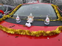 KRAKOW, POLAND - DECEMBER 08: Christmas decorations seen of cars parked outside the Pediatric Hospital in Krakow as Santa Clauses deliver Ch...