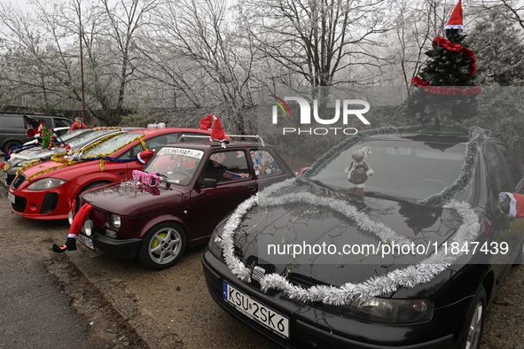 KRAKOW, POLAND - DECEMBER 08: Christmas decorations seen of cars parked outside the Pediatric Hospital in Krakow as Santa Clauses deliver Ch...