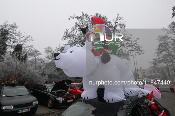 KRAKOW, POLAND - DECEMBER 08: Christmas decorations seen of cars parked outside the Pediatric Hospital in Krakow as Santa Clauses deliver Ch...