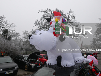 KRAKOW, POLAND - DECEMBER 08: Christmas decorations seen of cars parked outside the Pediatric Hospital in Krakow as Santa Clauses deliver Ch...