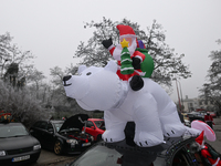 KRAKOW, POLAND - DECEMBER 08: Christmas decorations seen of cars parked outside the Pediatric Hospital in Krakow as Santa Clauses deliver Ch...