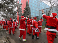 KRAKOW, POLAND - DECEMBER 08: Hundreds of motorcycle riders dressed as Santa Claus circle the Pediatric Hospital, shouting 'Ho Ho Ho' and wa...