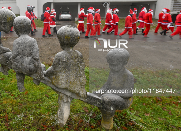 KRAKOW, POLAND - DECEMBER 08: Hundreds of motorcycle riders dressed as Santa Claus circle the Pediatric Hospital, shouting 'Ho Ho Ho' and wa...