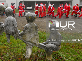 KRAKOW, POLAND - DECEMBER 08: Hundreds of motorcycle riders dressed as Santa Claus circle the Pediatric Hospital, shouting 'Ho Ho Ho' and wa...