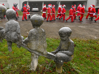 KRAKOW, POLAND - DECEMBER 08: Hundreds of motorcycle riders dressed as Santa Claus circle the Pediatric Hospital, shouting 'Ho Ho Ho' and wa...