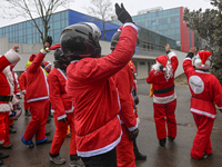 KRAKOW, POLAND - DECEMBER 08: Hundreds of motorcycle riders dressed as Santa Claus circle the Pediatric Hospital, shouting 'Ho Ho Ho' and wa...