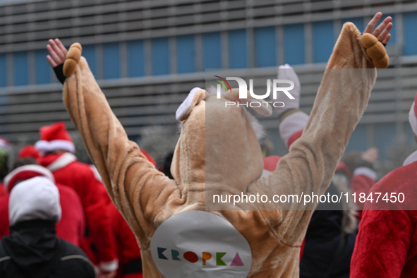 KRAKOW, POLAND - DECEMBER 08: Hundreds of motorcycle riders dressed as Santa Claus circle the Pediatric Hospital, shouting 'Ho Ho Ho' and wa...