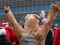 KRAKOW, POLAND - DECEMBER 08: Hundreds of motorcycle riders dressed as Santa Claus circle the Pediatric Hospital, shouting 'Ho Ho Ho' and wa...