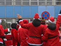 KRAKOW, POLAND - DECEMBER 08: Hundreds of motorcycle riders dressed as Santa Claus circle the Pediatric Hospital, shouting 'Ho Ho Ho' and wa...