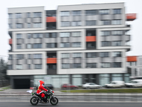 KRAKOW, POLAND - DECEMBER 08: 
A motorcycle rider dressed as Santa Claus seen after delivering Christmas gifts to young patients at the Pedi...