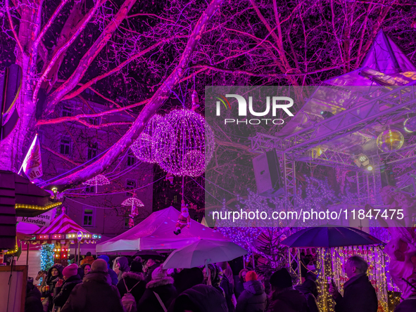 The Pink Christmas market at Stephansplatz in Munich, Bavaria, Germany, on December 8, 2024, lights up in its signature pink hues. Known as...