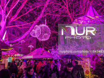 The Pink Christmas market at Stephansplatz in Munich, Bavaria, Germany, on December 8, 2024, lights up in its signature pink hues. Known as...