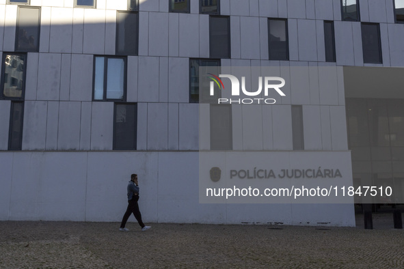 In Lisbon, Portugal, on December 8, 2024, people walk by the Judiciary Police Headquarters. The Judiciary Police (PJ) carry out a major oper...