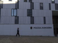 In Lisbon, Portugal, on December 8, 2024, people walk by the Judiciary Police Headquarters. The Judiciary Police (PJ) carry out a major oper...