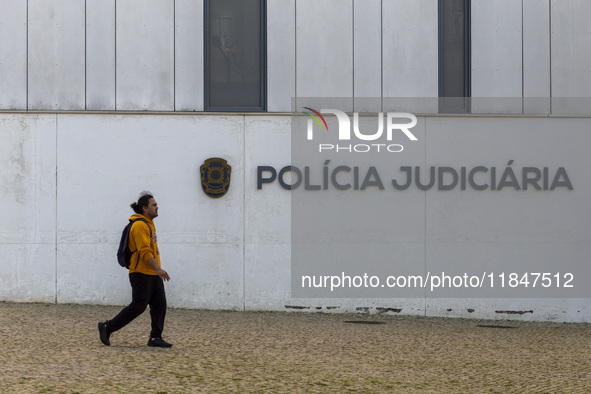 In Lisbon, Portugal, on December 8, 2024, people walk by the Judiciary Police Headquarters. The Judiciary Police (PJ) carry out a major oper...