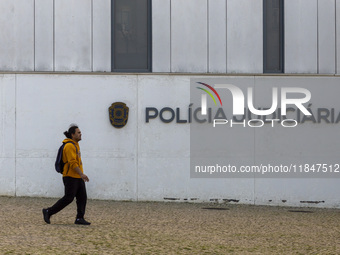 In Lisbon, Portugal, on December 8, 2024, people walk by the Judiciary Police Headquarters. The Judiciary Police (PJ) carry out a major oper...