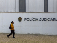 In Lisbon, Portugal, on December 8, 2024, people walk by the Judiciary Police Headquarters. The Judiciary Police (PJ) carry out a major oper...