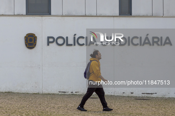 In Lisbon, Portugal, on December 8, 2024, people walk by the Judiciary Police Headquarters. The Judiciary Police (PJ) carry out a major oper...