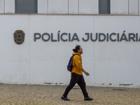 In Lisbon, Portugal, on December 8, 2024, people walk by the Judiciary Police Headquarters. The Judiciary Police (PJ) carry out a major oper...