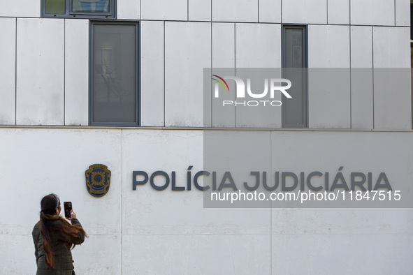 In Lisbon, Portugal, on December 8, 2024, people walk by the Judiciary Police Headquarters. The Judiciary Police (PJ) carry out a major oper...