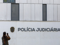 In Lisbon, Portugal, on December 8, 2024, people walk by the Judiciary Police Headquarters. The Judiciary Police (PJ) carry out a major oper...