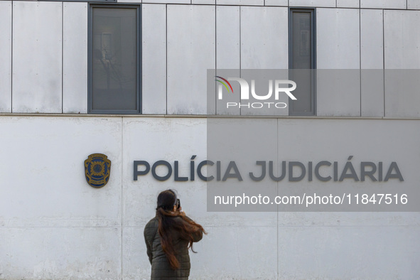 In Lisbon, Portugal, on December 8, 2024, people walk by the Judiciary Police Headquarters. The Judiciary Police (PJ) carry out a major oper...