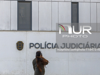 In Lisbon, Portugal, on December 8, 2024, people walk by the Judiciary Police Headquarters. The Judiciary Police (PJ) carry out a major oper...