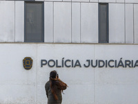 In Lisbon, Portugal, on December 8, 2024, people walk by the Judiciary Police Headquarters. The Judiciary Police (PJ) carry out a major oper...