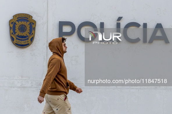 In Lisbon, Portugal, on December 8, 2024, people walk by the Judiciary Police Headquarters. The Judiciary Police (PJ) carry out a major oper...