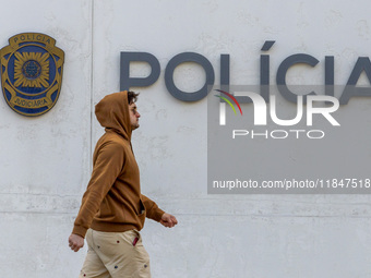 In Lisbon, Portugal, on December 8, 2024, people walk by the Judiciary Police Headquarters. The Judiciary Police (PJ) carry out a major oper...