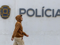 In Lisbon, Portugal, on December 8, 2024, people walk by the Judiciary Police Headquarters. The Judiciary Police (PJ) carry out a major oper...