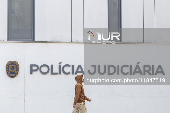 In Lisbon, Portugal, on December 8, 2024, people walk by the Judiciary Police Headquarters. The Judiciary Police (PJ) carry out a major oper...