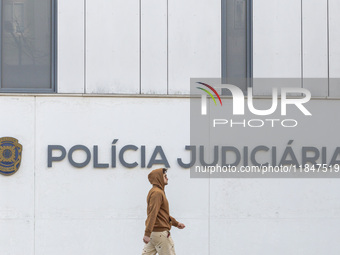 In Lisbon, Portugal, on December 8, 2024, people walk by the Judiciary Police Headquarters. The Judiciary Police (PJ) carry out a major oper...