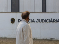 A person walks by the Judiciary Police Headquarters in Lisbon, Portugal, on December 8, 2024. The Judiciary Police (PJ) carry out a major op...