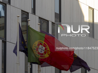 A Portugal flag moves in the wind at the Judiciary Police Headquarters in Lisbon, Portugal, on December 8, 2024. The Judiciary Police (PJ) c...