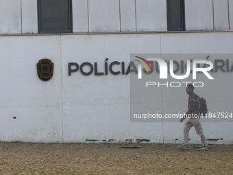 A person walks by the Judiciary Police Headquarters in Lisbon, Portugal, on December 8, 2024. The Judiciary Police (PJ) carry out a major op...