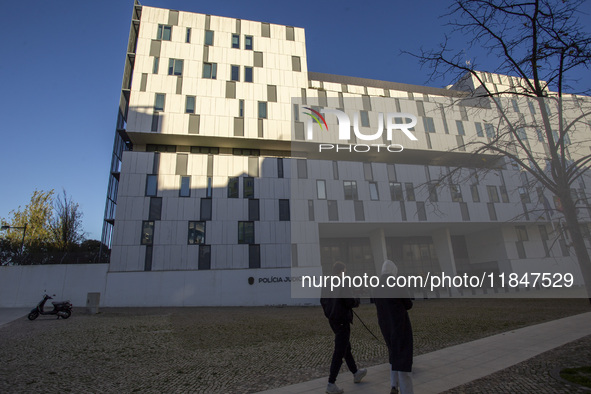 In Lisbon, Portugal, on December 8, 2024, people walk by the Judiciary Police Headquarters. The Judiciary Police (PJ) carry out a major oper...