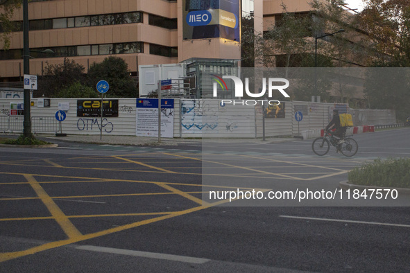 A food delivery person rides a bike in Lisbon, Portugal, on December 8, 2024. Glovo, the app-based food delivery service, hires its freelanc...