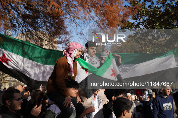 Syrian opposition supporters gather in Lafayette Park next to the White House to celebrate the fall of Bashar al-Assad on December 8, 2024 