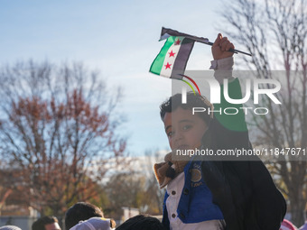 Syrian opposition supporters gather in Lafayette Park next to the White House to celebrate the fall of Bashar al-Assad on December 8, 2024 (