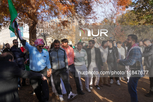 Syrian opposition supporters gather in Lafayette Park next to the White House to celebrate the fall of Bashar al-Assad on December 8, 2024 