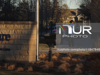 A security guard walks towards the front of the UnitedHealthcare corporate headquarters in Minnetonka, on December 5, 2024. Increased securi...