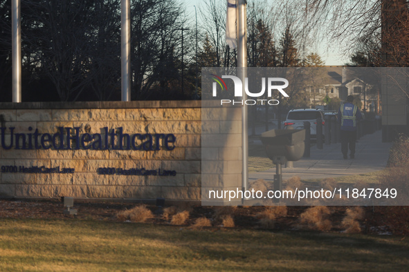 A security guard walks towards the front of the UnitedHealthcare corporate headquarters in Minnetonka, on December 5, 2024. Increased securi...