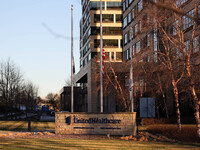 The front of the UnitedHealthcare corporate headquarters in Minnetonka, Minnesota, on December 5, 2024, shows flags flying at half-mast for...